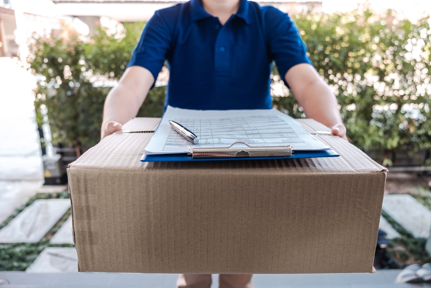 Man Delivering Parcel to Client 